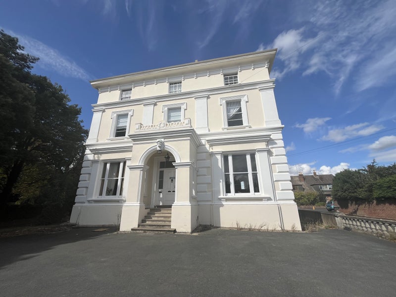 Photo 1: Front of building (the flat is bottom right)