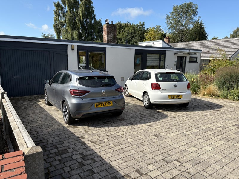 Photo 1: Front of house, parking, garage