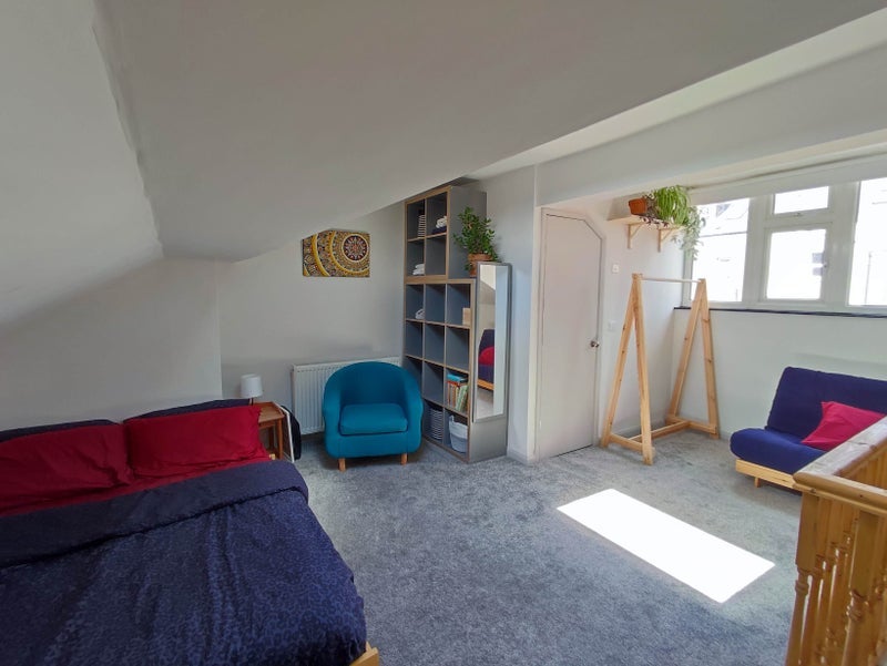 Photo 1: Room with futon as a sofa