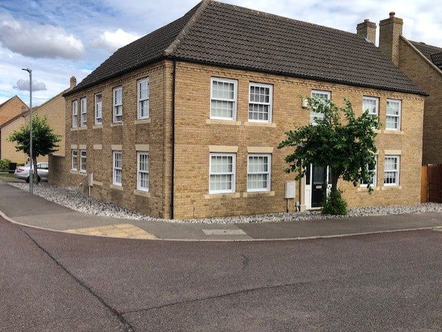Photo 1: Front and side of our big house