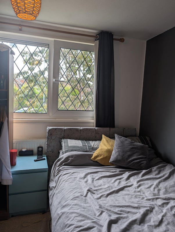 Photo 1: Front bedroom with large window