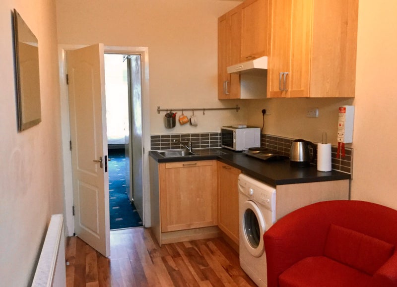 Photo 1: Kitchen and living room