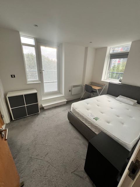 Photo 1: Bedroom with desk storage and built in wardrobe