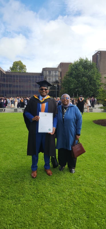 Photo 1: My mother and I on graduation day