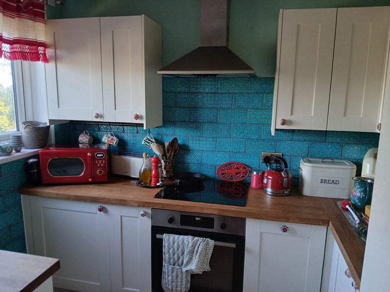 Photo 1: Kitchen includes dishwasher and washing machine
