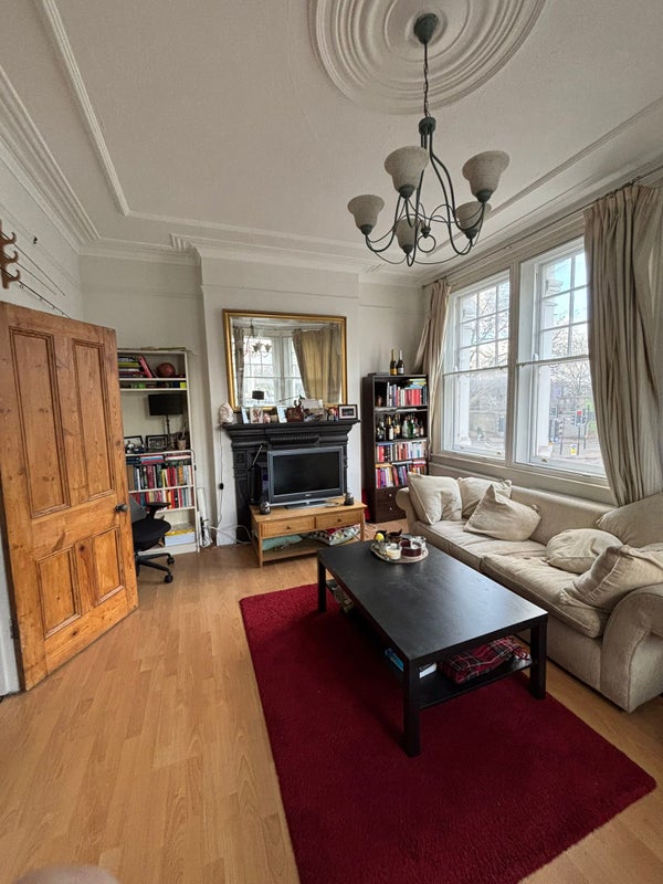 Photo 1: Large sitting room, with two sofas and plenty of space to work from home