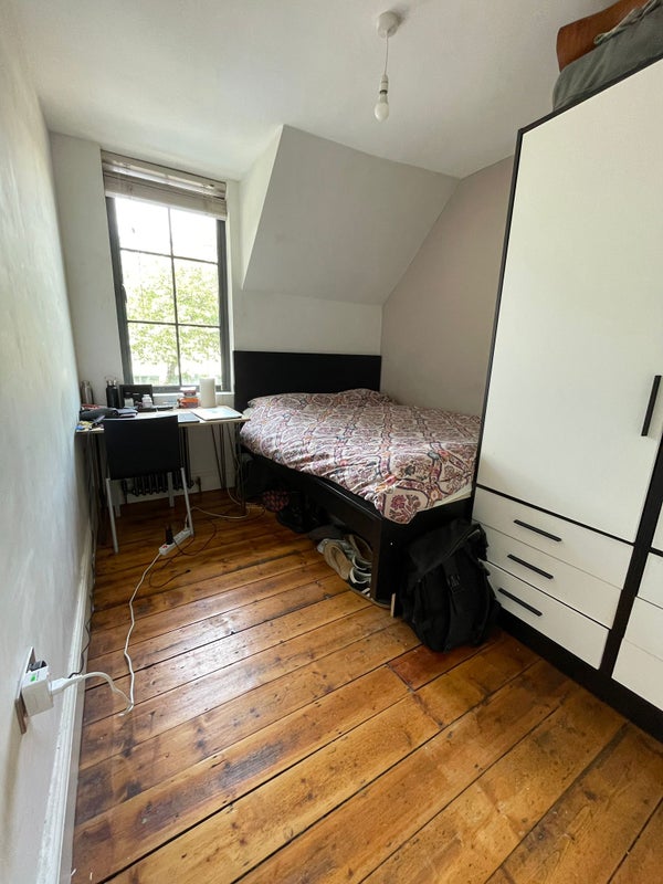 Photo 1: Room is currently arranged like this with a small desk.