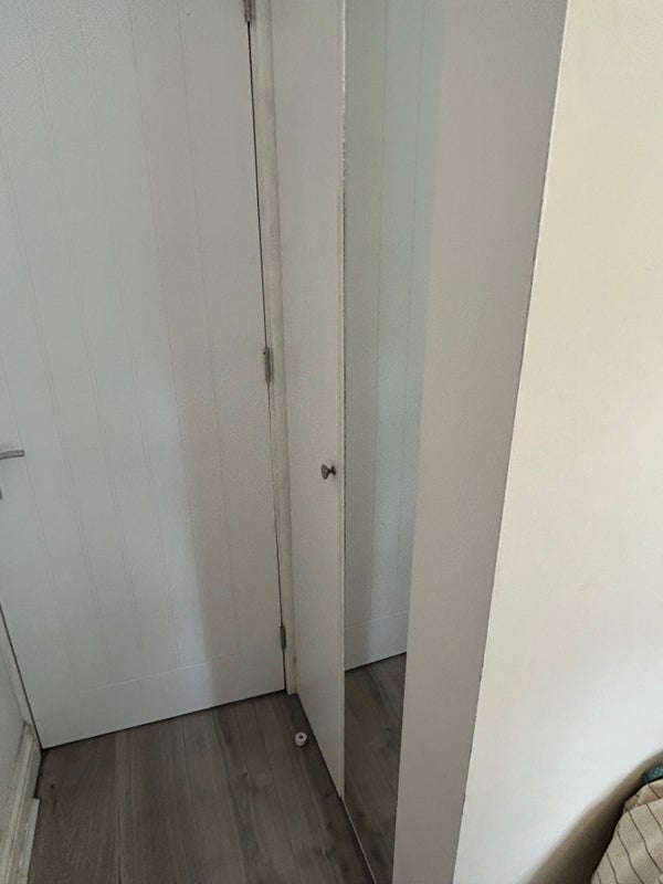 Photo 5: integrated floor to ceiling double wardrobe with mirrored door (room 1)