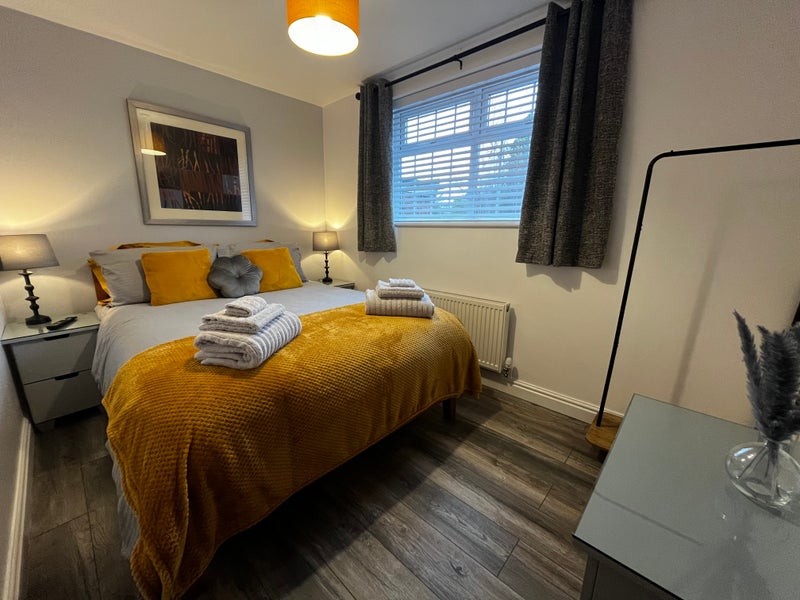Photo 1: Bright and stylishbedroom with king-size bed and modern decor
