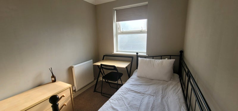 Photo 1: Black out blind, lamp and bedding.