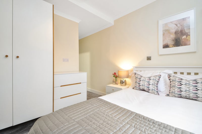 Photo 1: Room 5 - view to bed & wardrobe