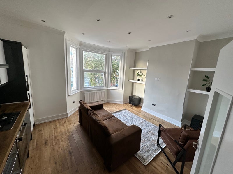 Photo 1: Kitchen/ Living room