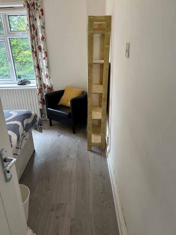 Photo 4: room over looks the back garden. Tube chair and shelves (room 1)