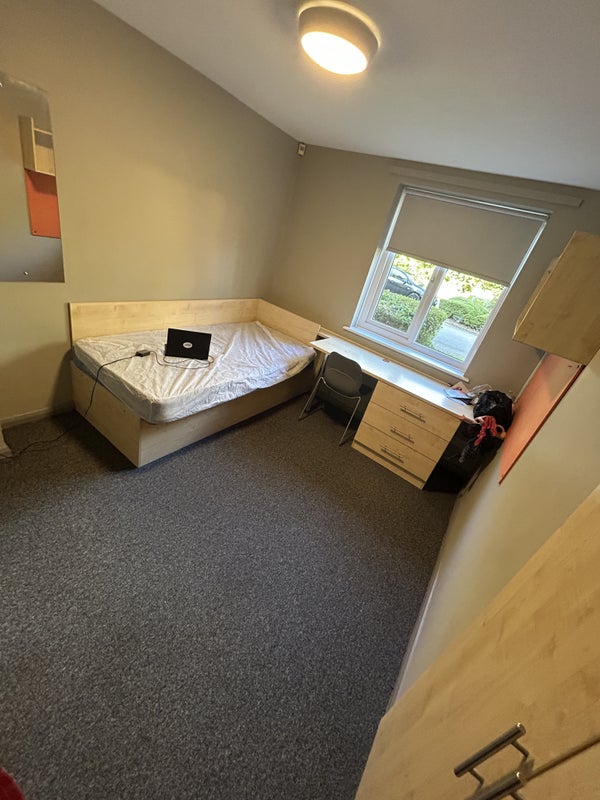 Photo 1: Room with single bed flat, wardrobe,desk,chair and cupboard 