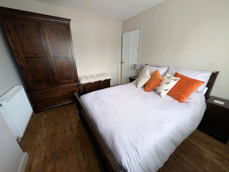 Photo 1: Large wardrobe with two large deep drawers. Space at the bottom and in the ottoman for storage.