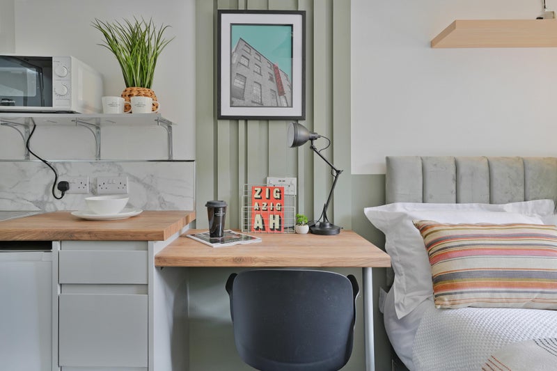 Photo 1: Desk with kitchenette