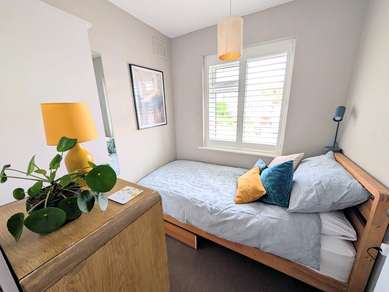 Photo 1: Single bedroom; mid-century modern design. All new furniture, shutters, and mattress.