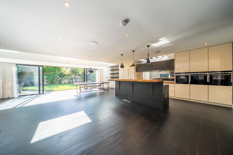 Photo 1: Comunal space kithen diner lliving