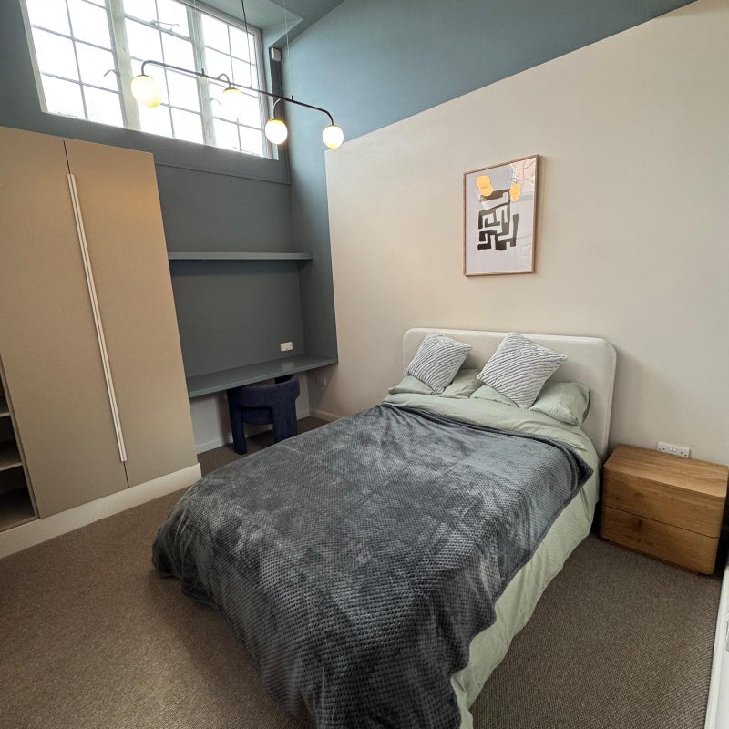 Photo 1: Room 4 desk and wardrobes
