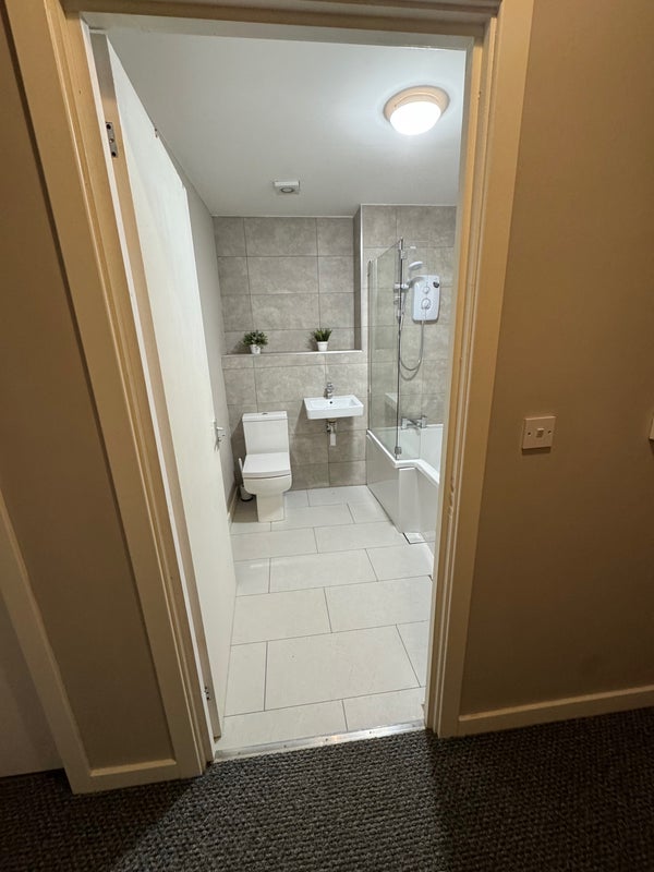 Photo 1: spoke to landlord, bath tile will be fixed