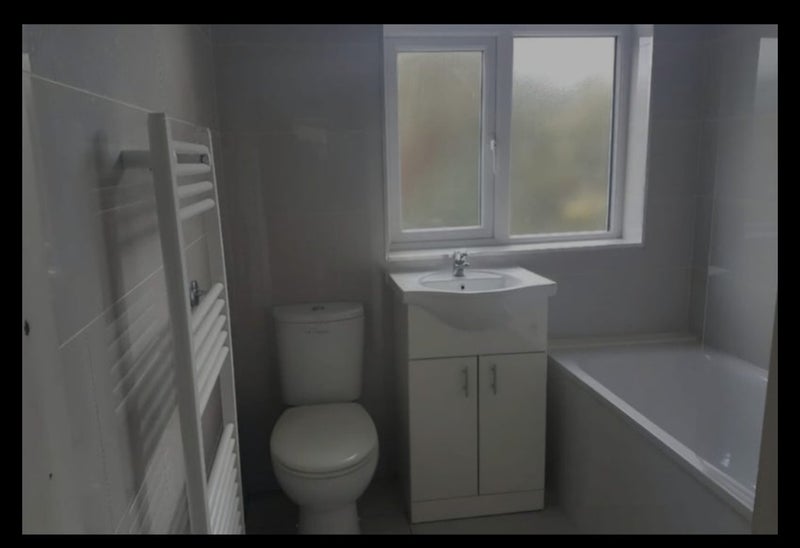 Photo 1: Shared bathroom.