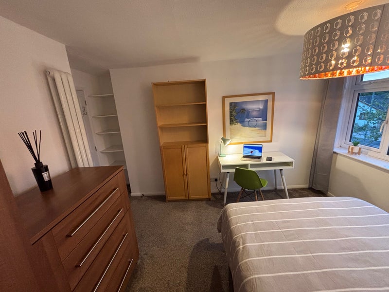 Photo 1: Wardrobe and drawers on the  left. Entrave is on the far left with storage shelves either side. 