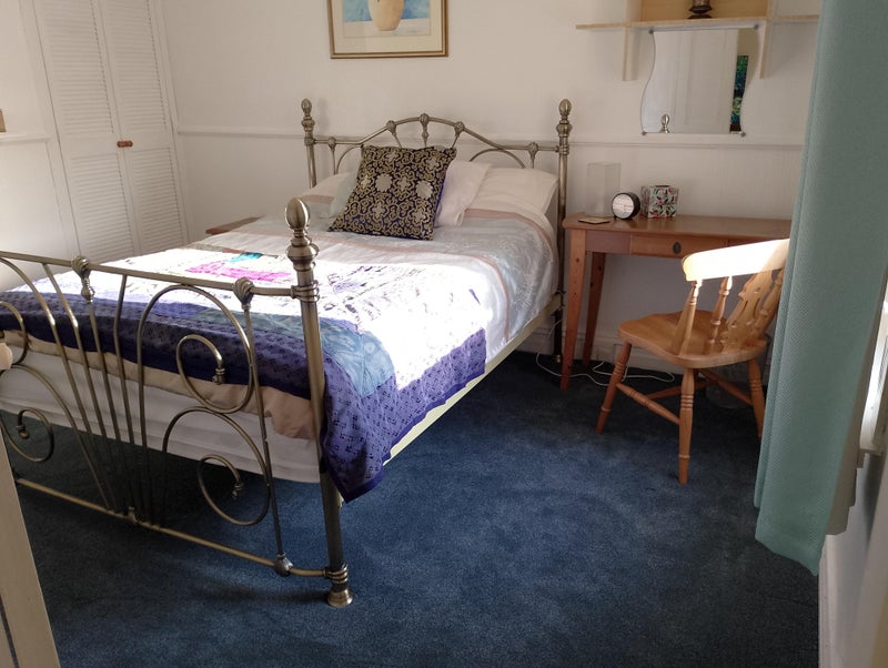 Photo 1: Comfortable mattress with desk area.