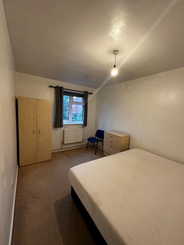 Photo 1: There is now a desk in the room as well