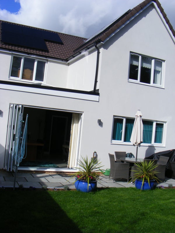 Photo 1: Back of house with sunny garden