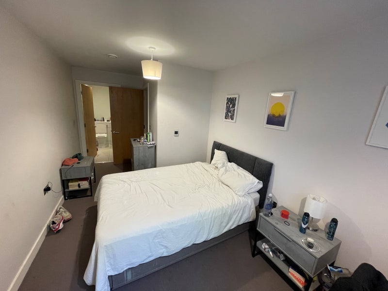 Photo 1: The bedroom (en suite in background)
