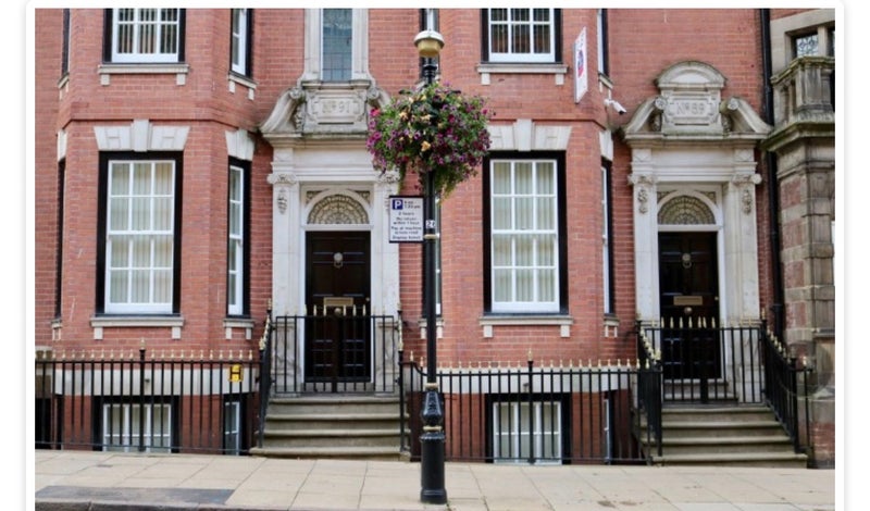 Photo 1: Front of building