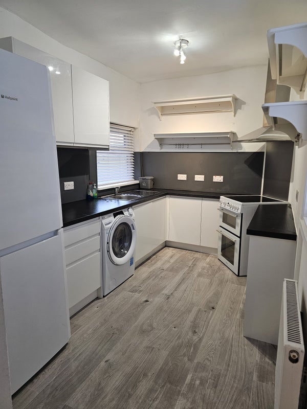 Photo 1: Kitchen with white goods