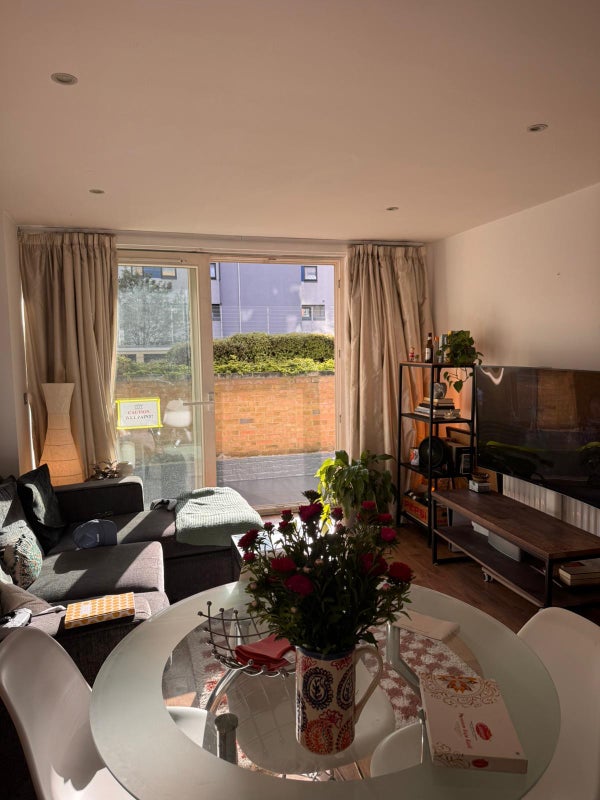 Photo 1: Living room with terrace in the background
