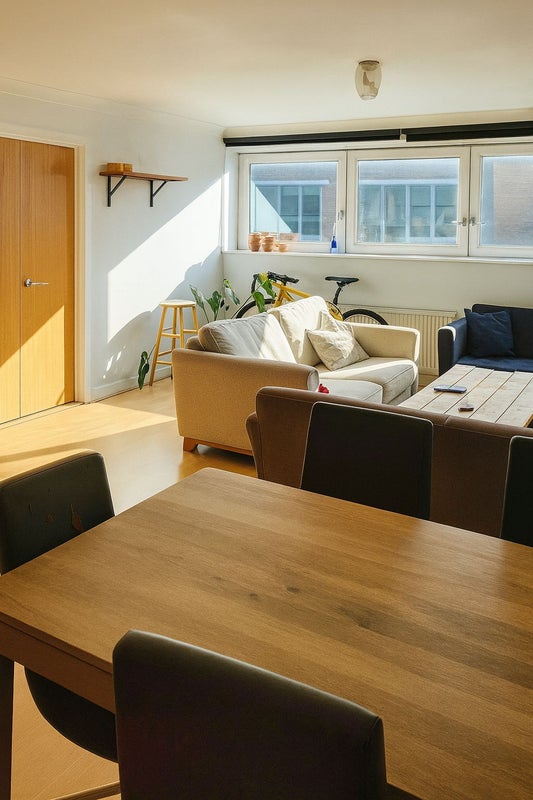 Photo 1: Bright living room with 3 sofas & TV