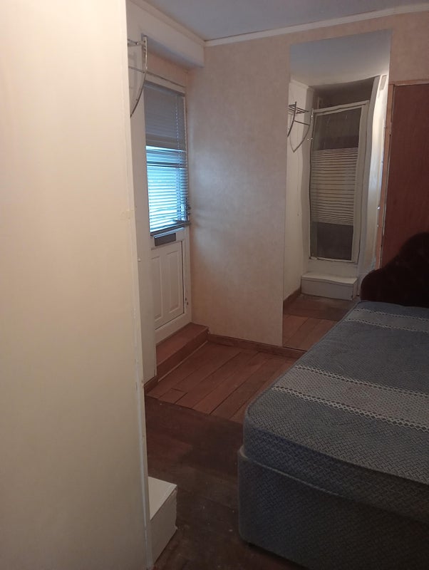 Photo 1: Bedroom with wall mirror 