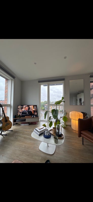 Photo 1: Lounge area with a balcony