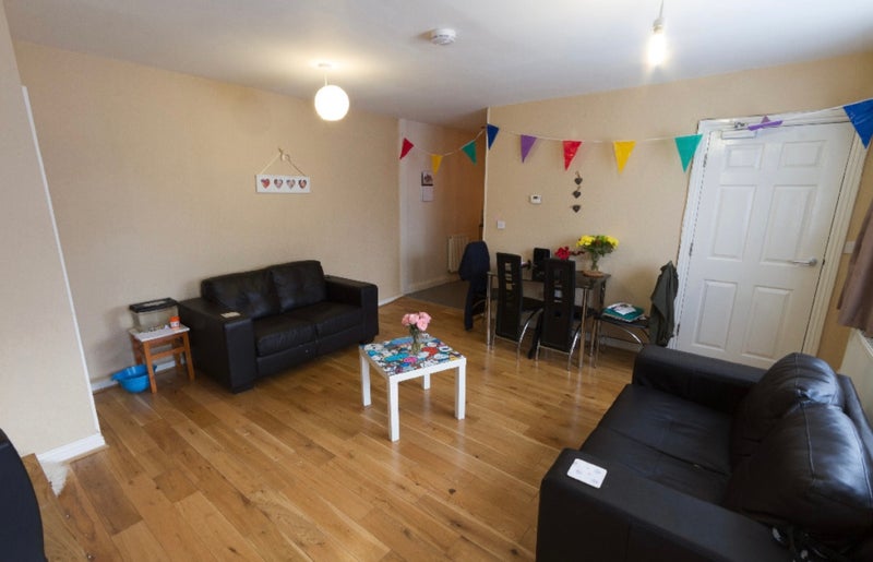 Photo 1: Shared living room, we do have a tv now!