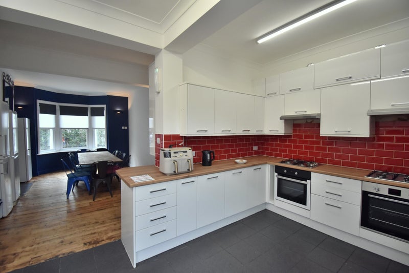 Photo 1: Kitchen / Dining Area