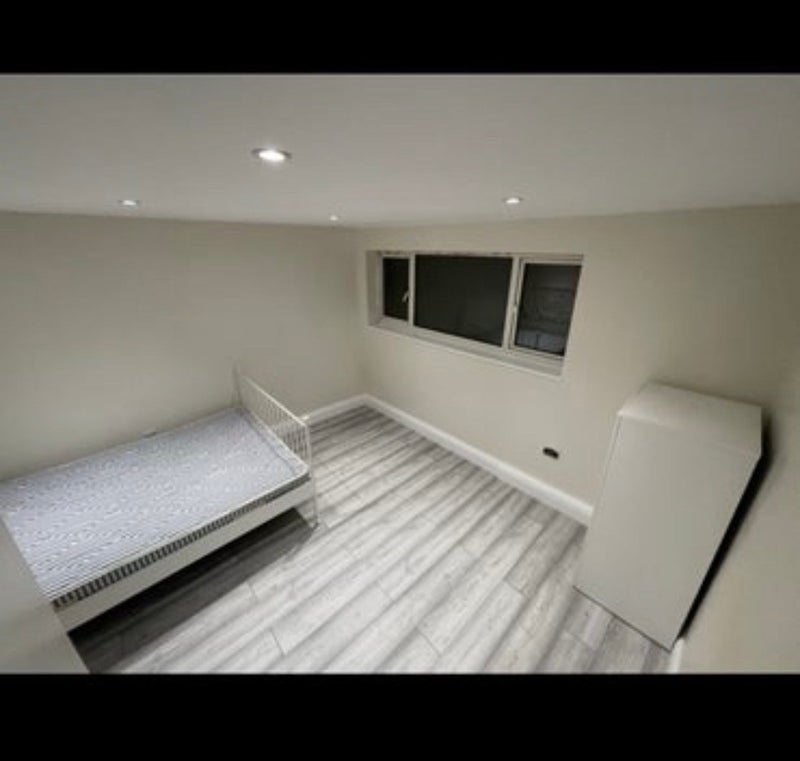 Photo 1: The room which now has curtains 