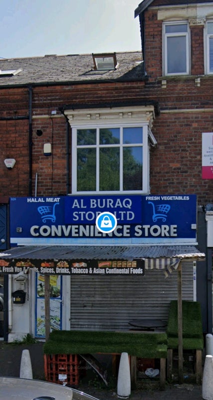 Photo 1: Flat is above the shop