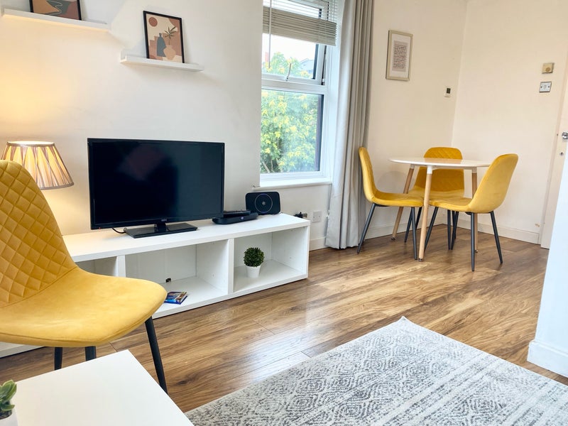 Photo 1: Living room and dinibg table