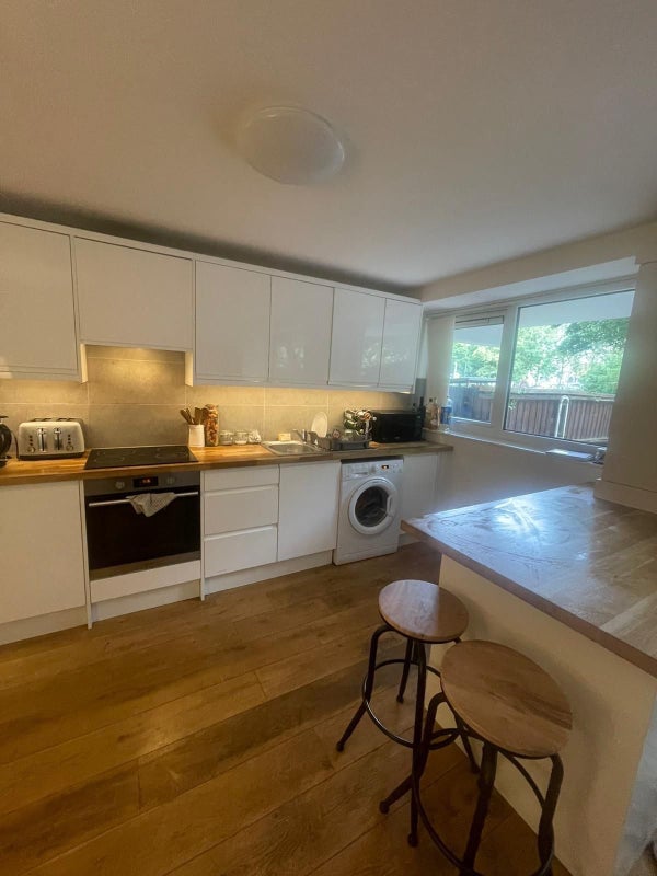 Photo 1: Kitchen / Living Area