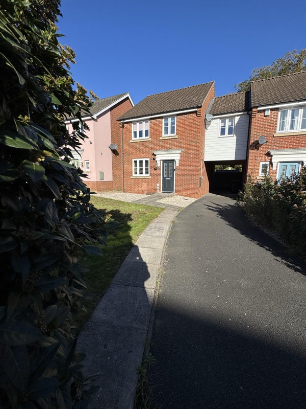 Photo 1: Front of house with private parking