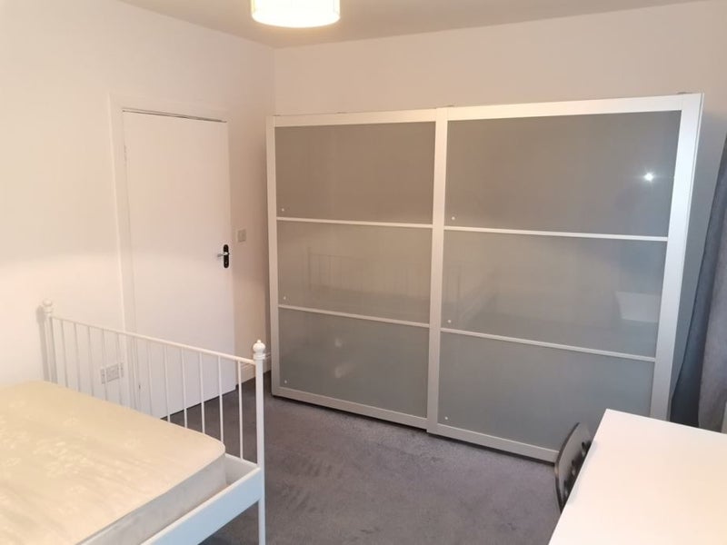 Photo 1: Bed, wardrobe, desk and chair in bedroom