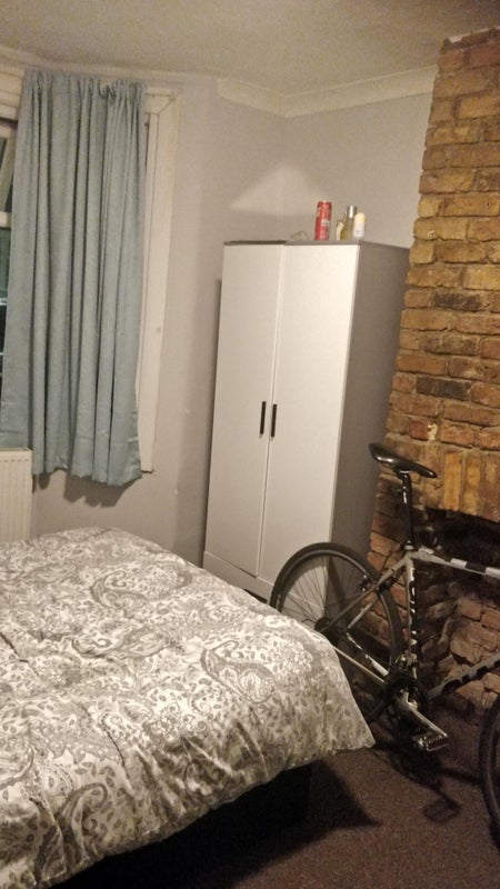 Photo 1: Cupboard by fireplace