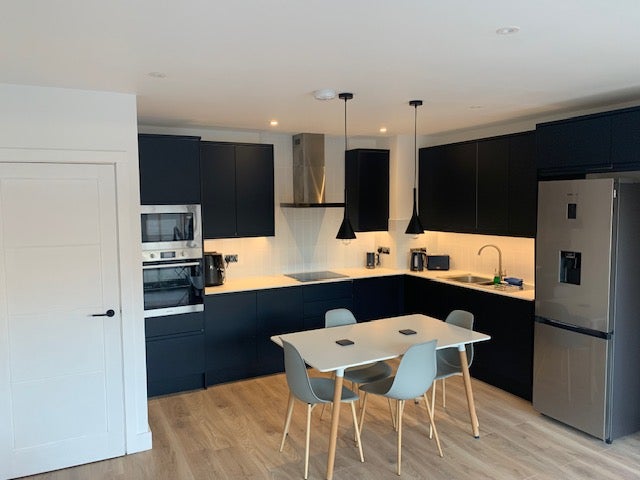 Photo 1: Brand new kitchen with 2 fridge/freezers 