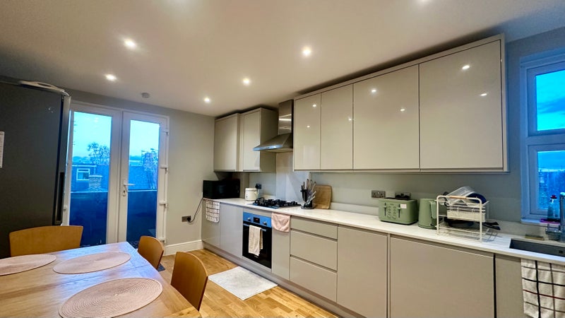 Photo 1: Modern kitchen and dining room