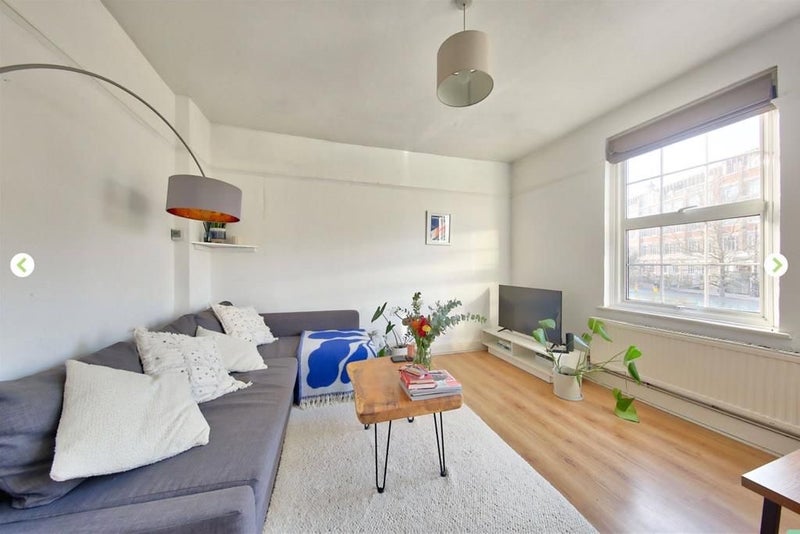 Photo 1: Living room - big dining room table on the left that you can’t see & a fireplace.