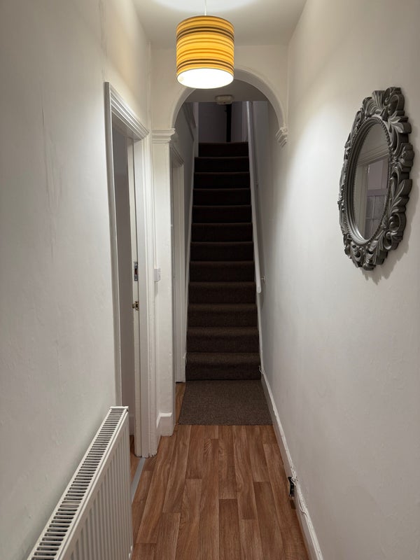 Photo 1: Downstairs hallway