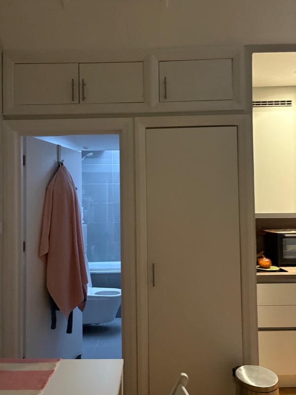 Photo 1: Door to toilet/washer